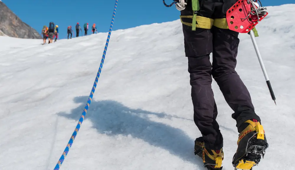 Crampons and ropes on a glacier hike. 