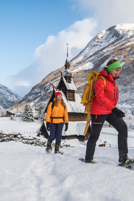 Two people on a snowshoe hike on Kongevegen, by Borgund Stave Church