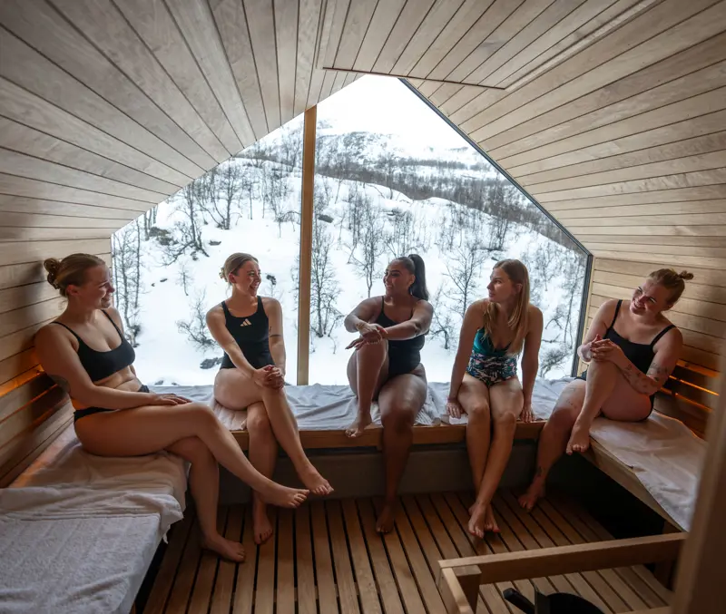 Friends enjoying a sauna at Filefjellstuene on a winter day