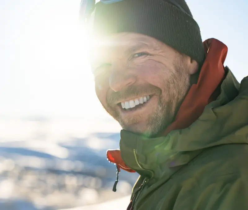 Smiling skier in winter sun from Tyin Filefjell