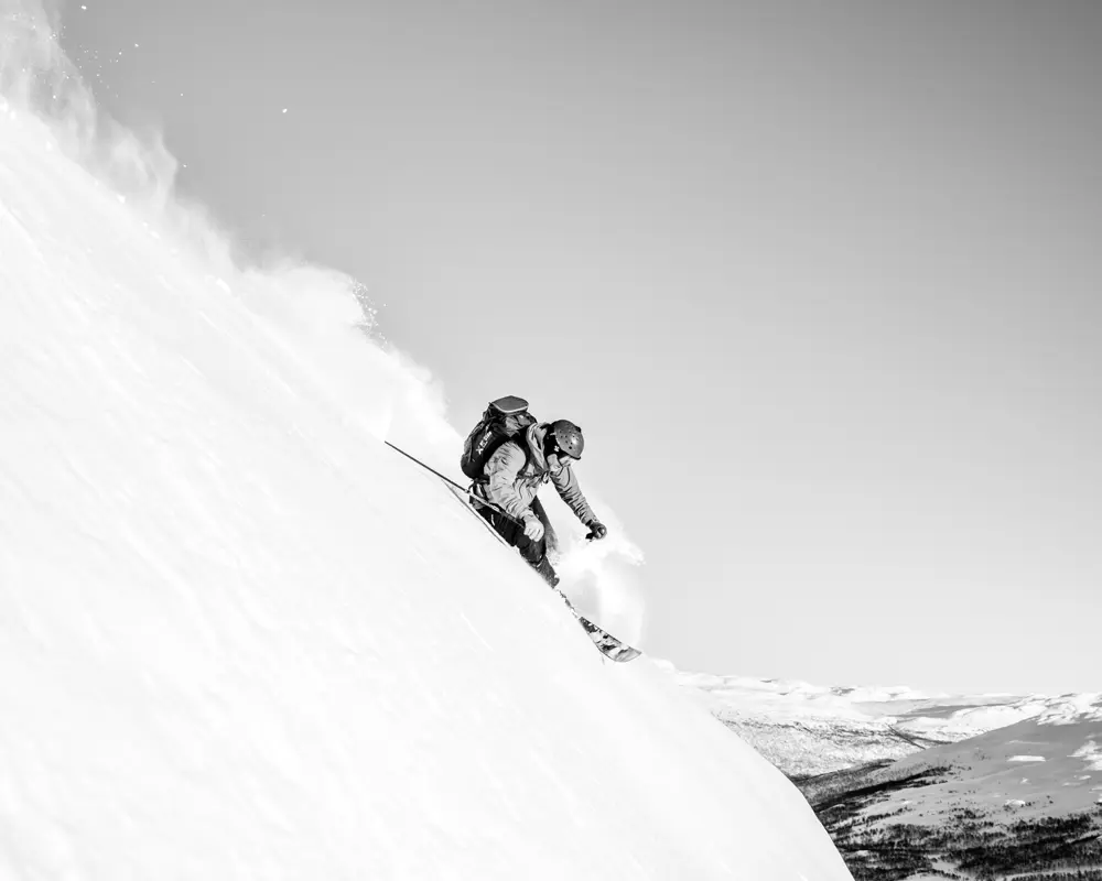 Skier on his way down from Skørsnøse on a hiking trip from Tyin Filefjell