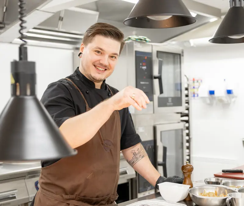 Chef prepares delicious food in the kitchen at Filefjellstuene